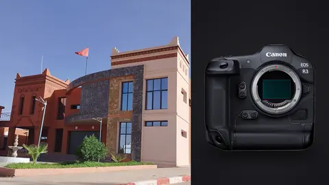Canon EOS R3 product photo beside modern reddish government building facade with tower