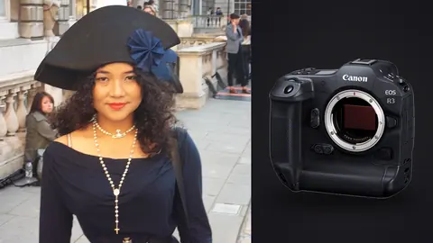 Canon EOS R3 product photo beside woman in an elaborate black hat and navy dress with pearls