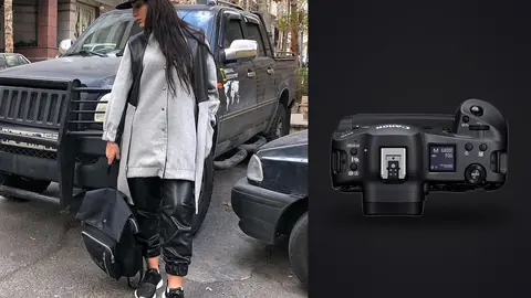 Canon EOS R3 product photo beside woman in a gray coat and black trousers stands by a van