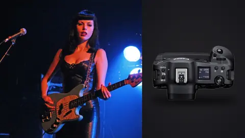 Canon EOS R3 product photo beside female bassist performing on stage under blue lights