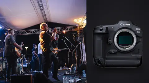 Canon EOS R3 product photo beside musicians performing on stage under tent lighting