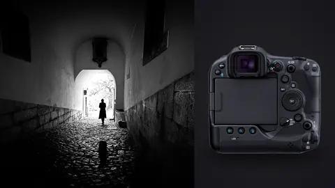 Canon EOS R3 product photo beside silhouetted figure walking through an archway toward daylight