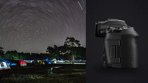 Canon EOS R5 Mark II product photo beside radiant star trails above a campsite with colorful tents