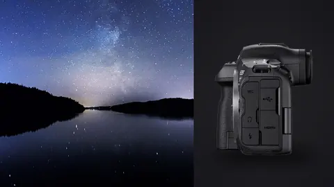 Canon EOS R5 Mark II product photo beside vivid milky way band over a calm fjord reflection between hills