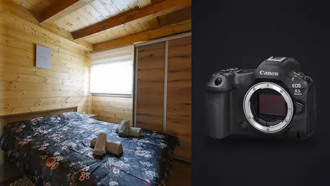 Canon EOS R5 Mark II product photo beside cozy wood cabin bedroom with a floral quilted bed