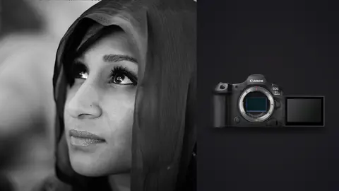 Canon EOS R5 Mark II product photo beside woman in a headscarf gazing upward in soft light