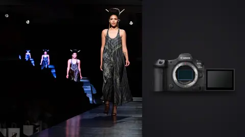 Canon EOS R5 Mark II product photo beside model in a dark patterned slip dress walking a runway