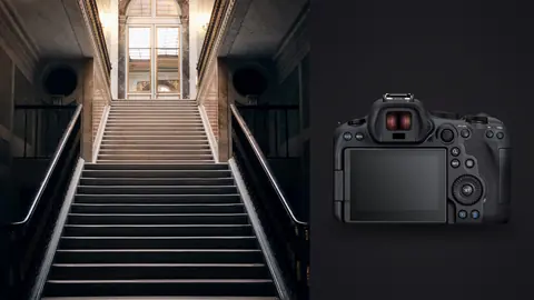 Canon EOS R6 Mark II product photo beside dramatic grand staircase leading to arched doorway