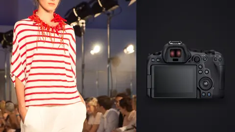 Canon EOS R6 Mark II product photo beside model in a red scarf and striped top at an outdoor show