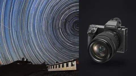 Fujifilm GFX100 II product photo beside circular star trails above an observatory building at dusk horizon
