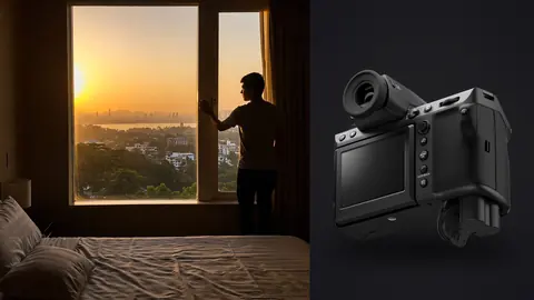 Fujifilm GFX100 II product photo beside silhouette of man at window during sunset