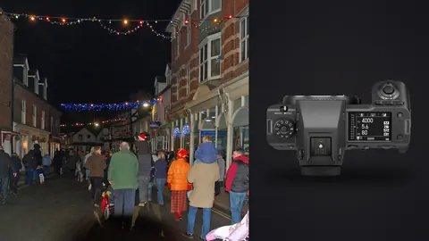 Fujifilm GFX100 II product photo beside crowd walking a christmas lit street at night