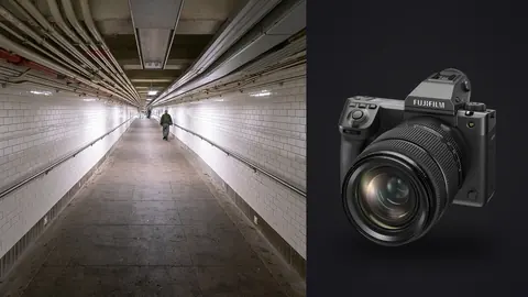Fujifilm GFX100 II product photo beside lone figure walking through a tiled subway tunnel