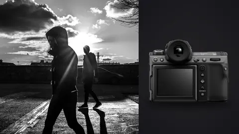 Fujifilm GFX100 II product photo beside figure walking a crosswalk casting a long sunset shadow