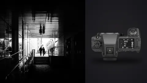 Fujifilm GFX100 II product photo beside couple walking away through a reflective underpass corridor