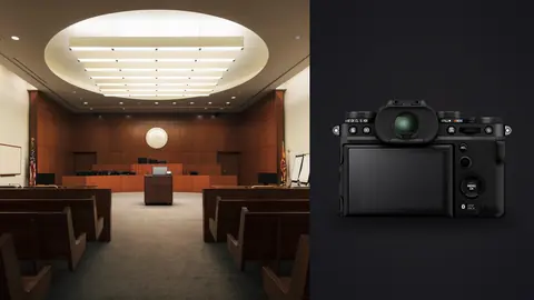 Fujifilm X-T5 product photo beside wood-paneled courtroom with judge's bench and pews