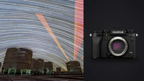 Fujifilm X-T5 product photo beside star trails with red laser beams above observatory domes