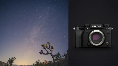 Fujifilm X-T5 product photo beside milky way band above a silhouetted joshua tree on a rock