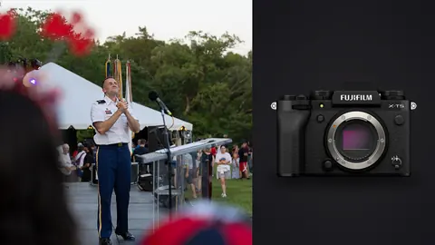 Fujifilm X-T5 product photo beside military band performer speaking outdoors
