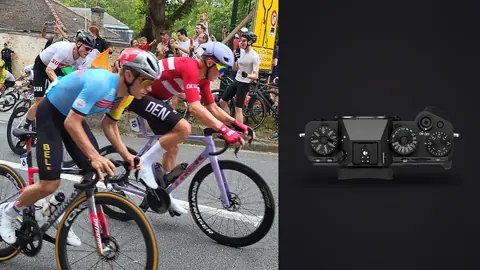 Fujifilm X-T5 product photo beside national team cyclists racing past fans in a village street