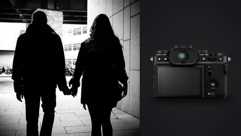 Fujifilm X-T5 product photo beside couple holding hands walking beneath an overpass