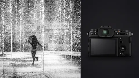 Fujifilm X-T5 product photo beside person dancing through jets of water in a fountain