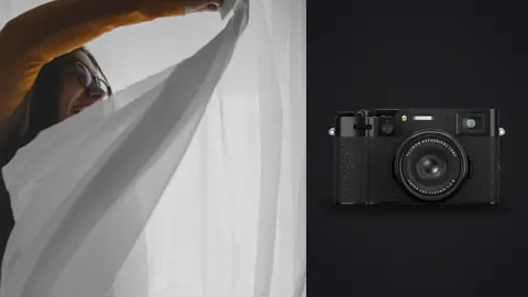 Fujifilm X100VI product photo beside arm reaching up wrapped in sheer curtain sheet
