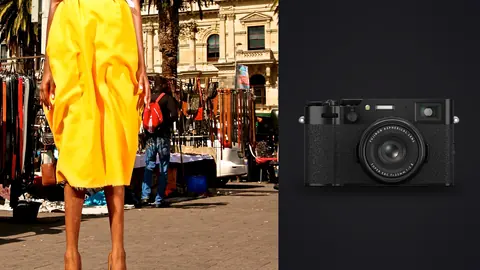 Fujifilm X100VI product photo beside woman in a floral top and yellow skirt walks a market street