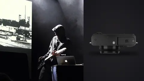 Fujifilm X100VI product photo beside silhouette of a performer on stage with a laptop