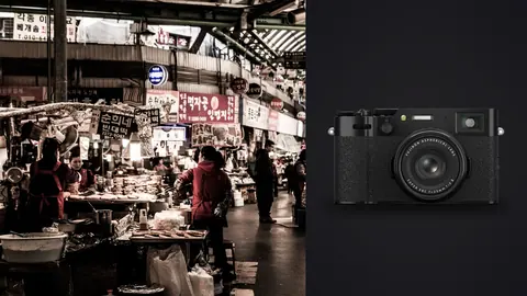 Fujifilm X100VI product photo beside shoppers browsing an indoor covered food market