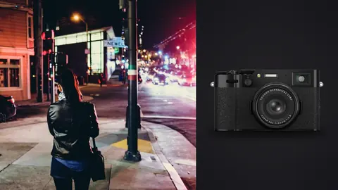 Fujifilm X100VI product photo beside woman waiting at a city street corner at night
