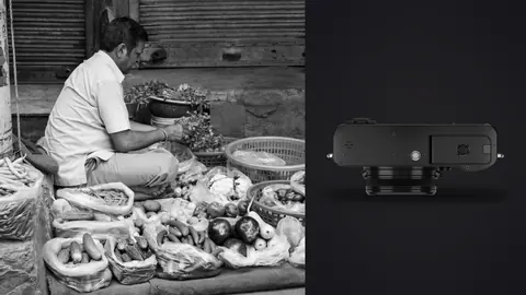 Fujifilm X100VI product photo beside vendor arranging bread and pastries at a market stall