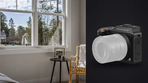 Hasselblad X2D 100C product photo beside window seat corner with wicker chair and tree view