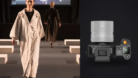 Hasselblad X2D 100C product photo beside model in an oversized beige coat walking down steps