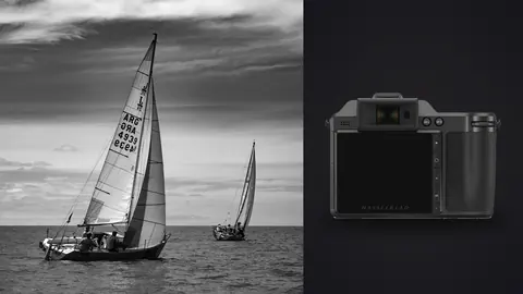 Hasselblad X2D 100C product photo beside sailboat crew racing with sails heeling in the wind