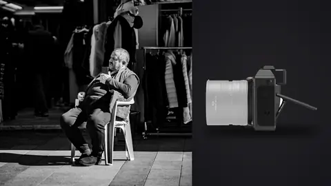 Hasselblad X2D 100C product photo beside elderly man reading a newspaper on a plastic chair