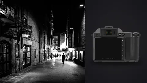 Hasselblad X2D 100C product photo beside silhouetted figure walking down a dark night alley