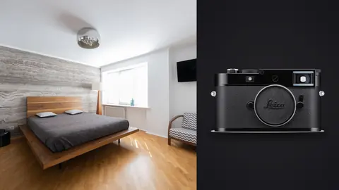Leica M11 product photo beside modern bedroom with wood accent wall