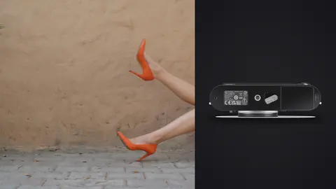 Leica M11 product photo beside stylized shot of legs in orange heels against a wall