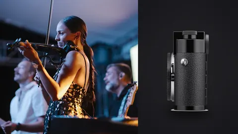 Leica M11 product photo beside violinist and pianist performing on stage