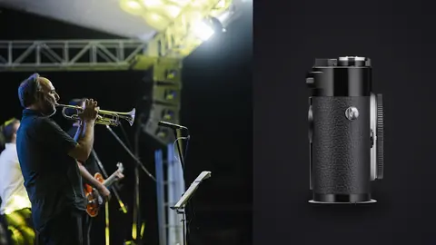 Leica M11 product photo beside musician playing trumpet on stage