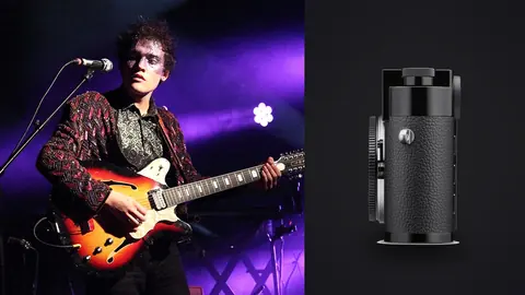 Leica M11 product photo beside guitarist performing on stage under purple lights