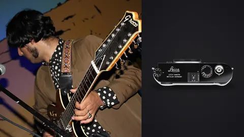 Leica M11 product photo beside guitarist playing on stage at a club