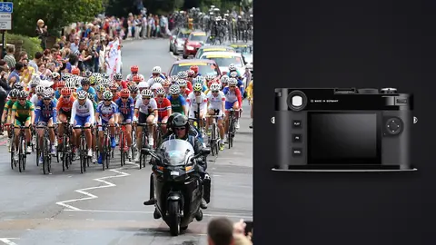 Leica M11 product photo beside olympic peloton led by a motorcycle past packed crowds