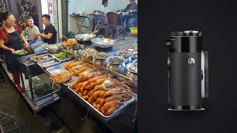 Leica M11 product photo beside street vendor cooking at a seafood food stall