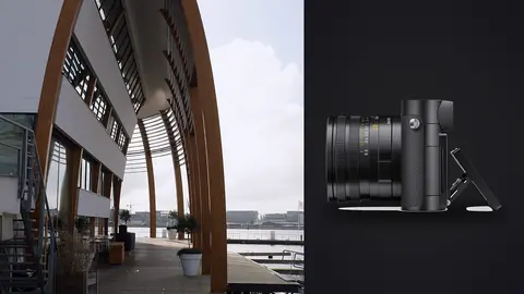 Leica Q3 product photo beside modern harbor building with curved wooden arch structure