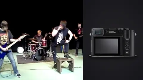 Leica Q3 product photo beside band performing on stage
