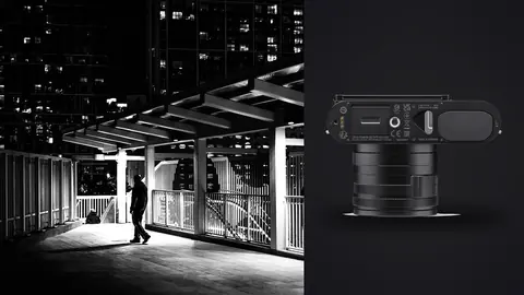 Leica Q3 product photo beside figure walking an elevated night walkway above a lit city