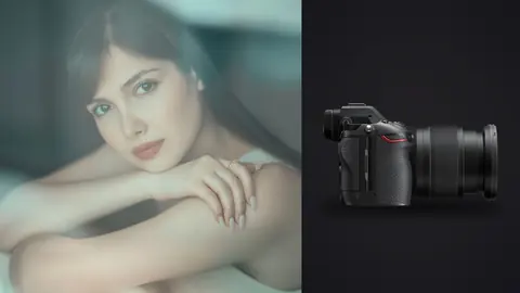 Nikon Z6 III product photo beside portrait resting chin on crossed arms near window
