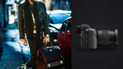 Nikon Z6 III product photo beside man in a green jacket carries a bag walking a city street at night